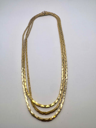 Sleek herringbone triple strand gold layered necklace